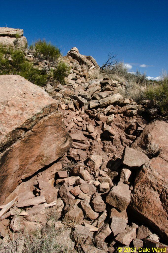 Rubble pile surrounding the boulders, from collapsed structures